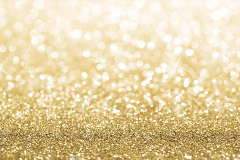 Gold defocused glitter background with copy space